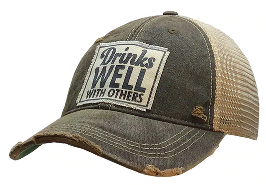Vintage Distressed Trucker Cap - "Drinks Well with Others" These distressed beer hats are incredibly comfortable. Most trucker caps are rigid, but these vintage unstructured caps are made of a cotton/polyester blend with a soft mesh back that makes them fit more like a "Dad Hat." Now in Canada.