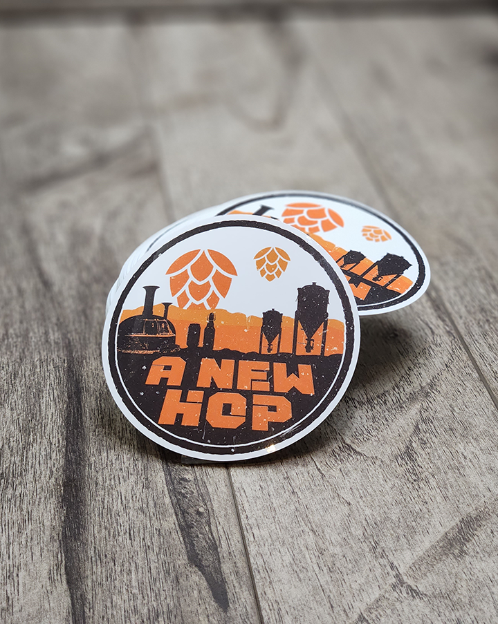 A New Hop beer sticker featuring a sci-fi inspired hop design, shown on waterproof vinyl